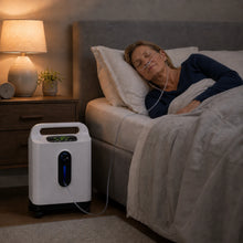 Senior using a 2-9L home continuous flow oxygen concentrator during nighttime oxygen therapy